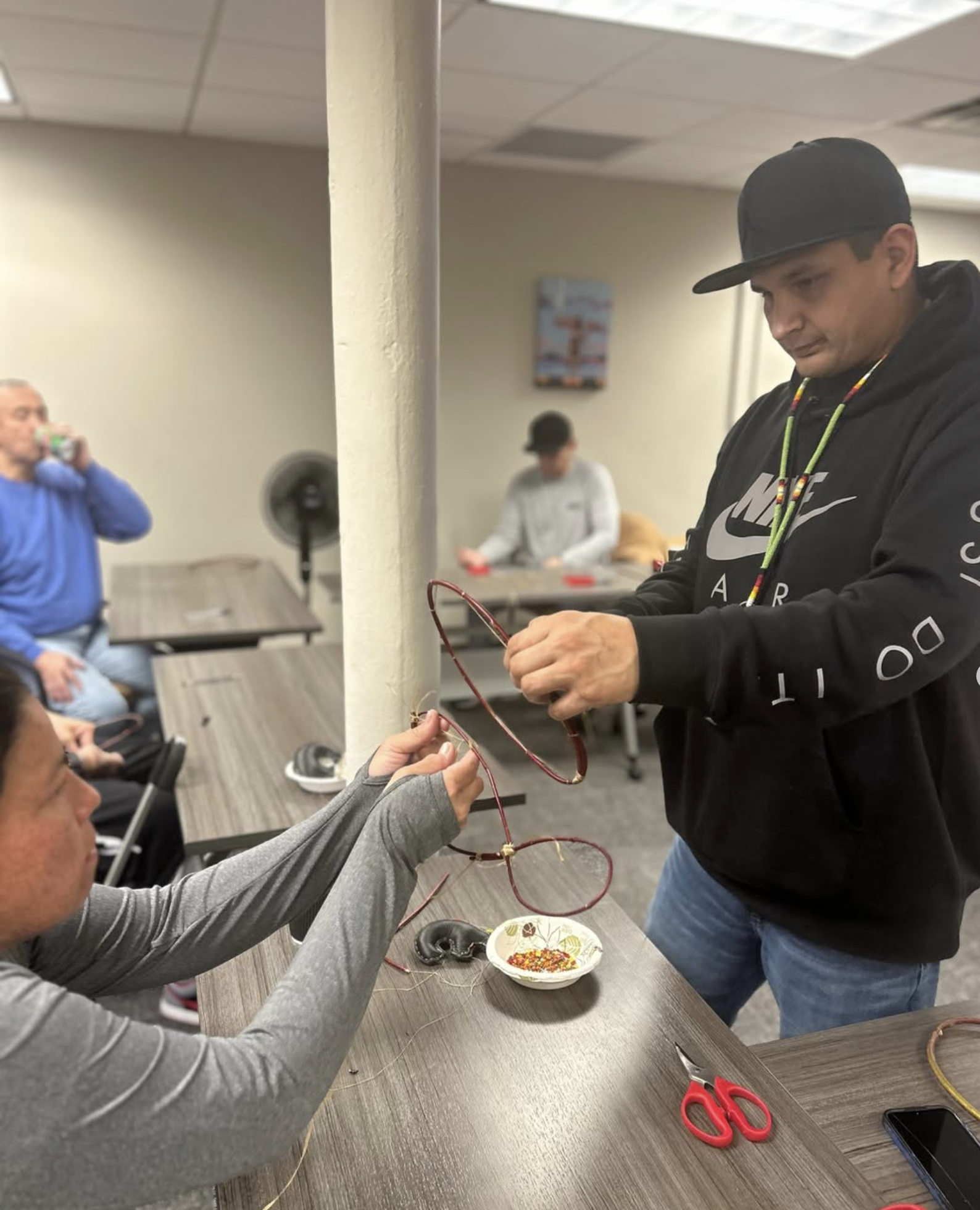 a person holding a wire around a person