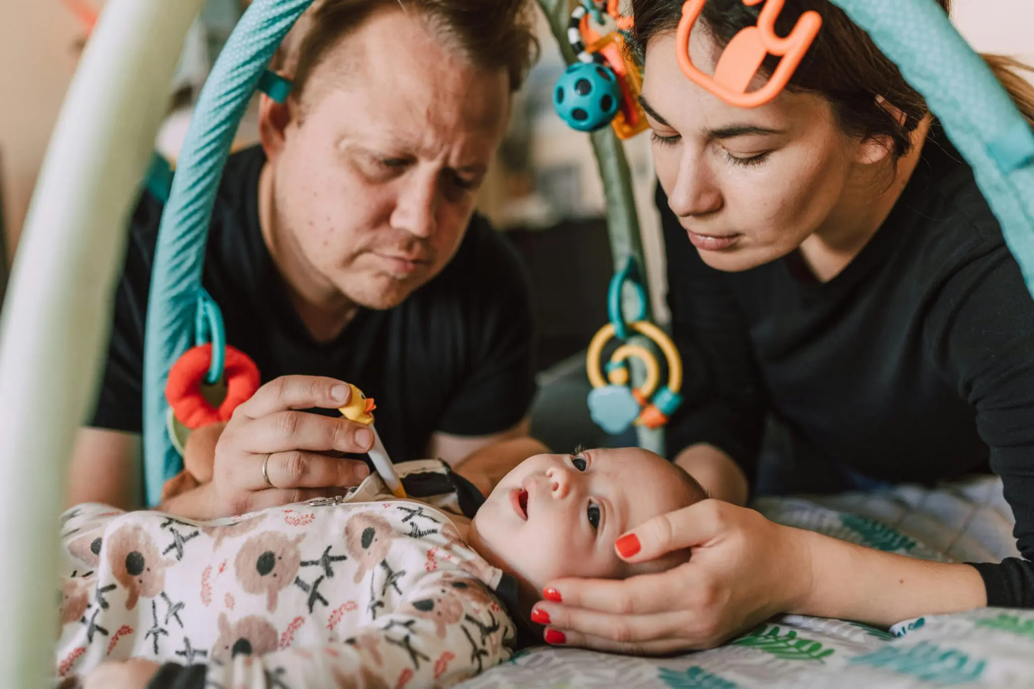 a person and person looking at a baby
