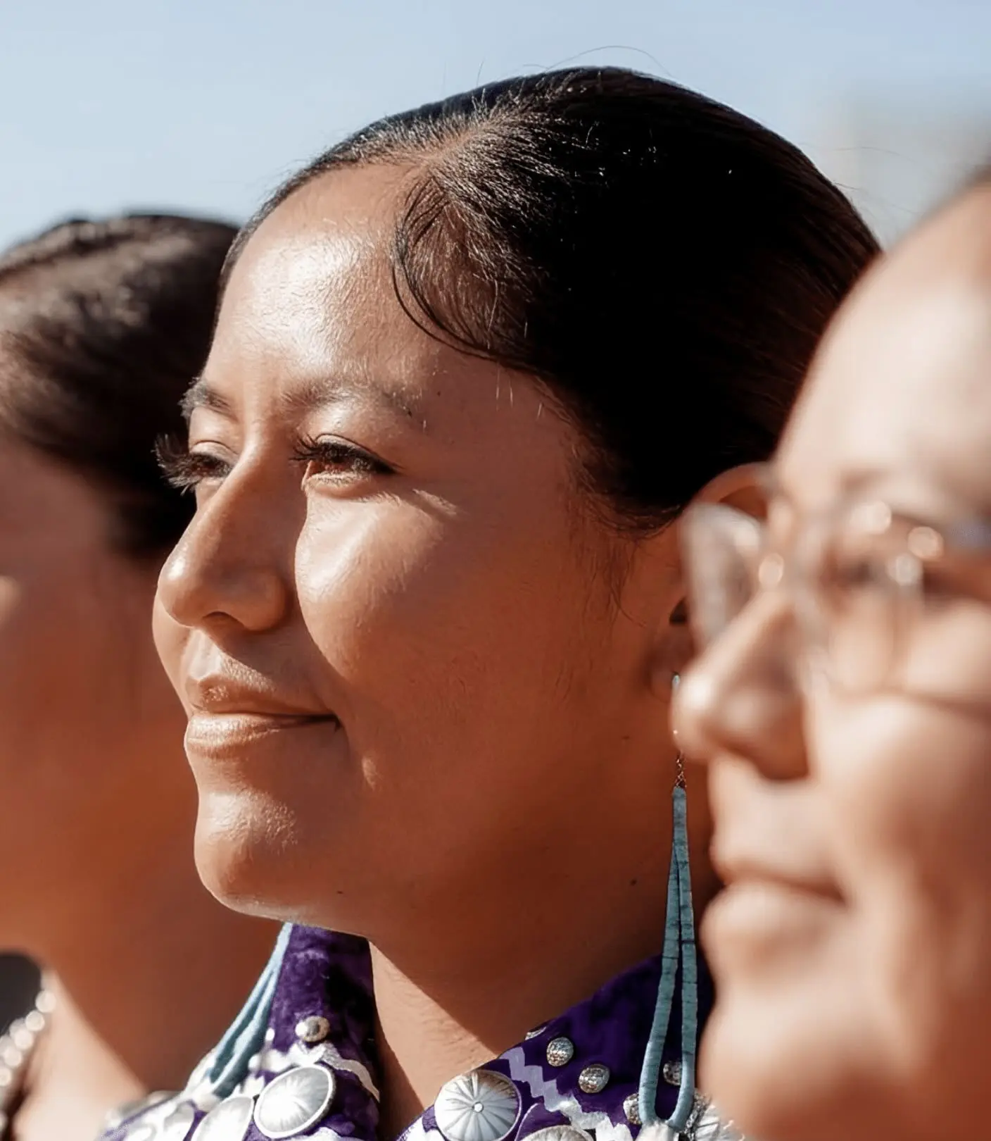 a group of women looking to the side